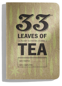 The cover of the 33 Leaves of Tea tasting journal. The notebook has a brown paper cover with rounded edges. The title is printed in black ink over a pattern of pale green leaves. It has lines to enter the Date Started and Date Completed.